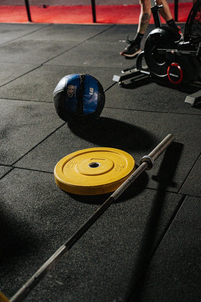 A vibrant gym setup featuring weights and fitness equipment ready for a workout.